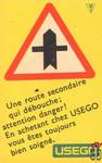 Une route secondaire qui debouche; attention danger! En achetant chez